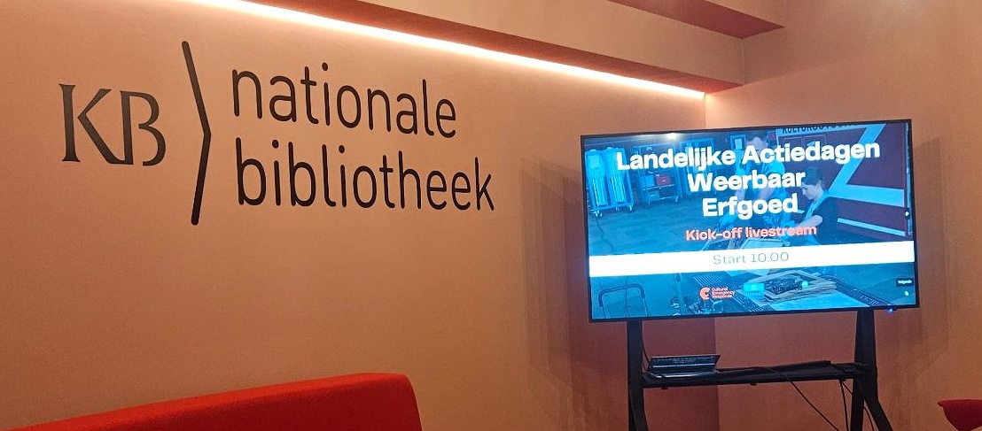 wall that says nationale bibliotheek and a screen that says Naitonal Action Day Resiliant Heritage in Dutch