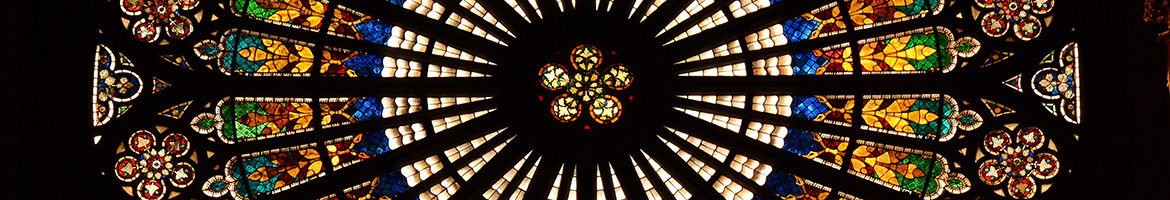 A circular stained glass window in a French church