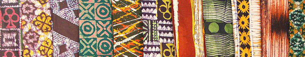 various patterns of kente cloth in Ghana laying in a line so that there is no space between them. Contrasting.