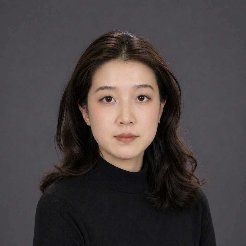 A Chinese woman with long hair sitting for a professional looking photo