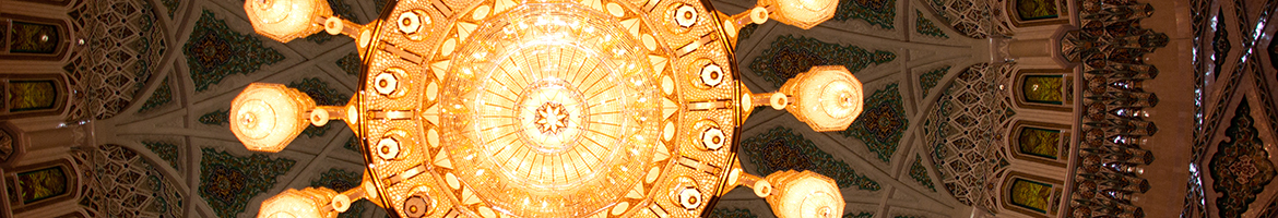 The ceiling of a mosque with an elaborate chandelier