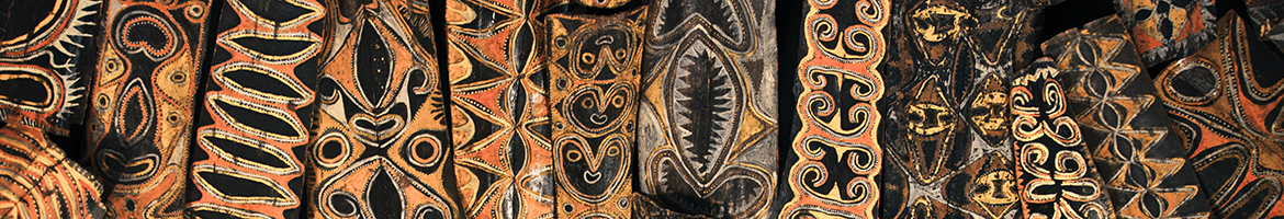 Wooden artworks from PNG with various patterns on a ceiling next to each other so there is no space between them