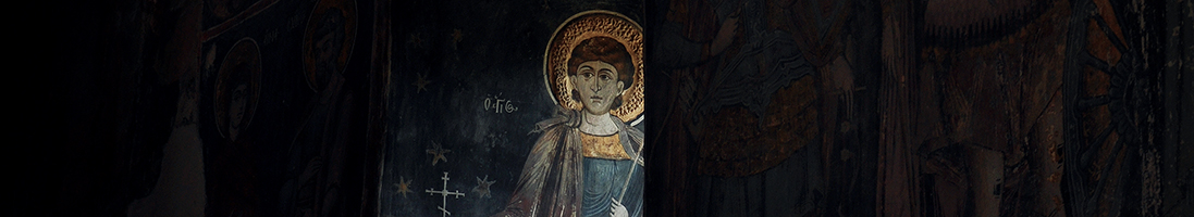 A Romanian fresco showing a saint with a gold halo
